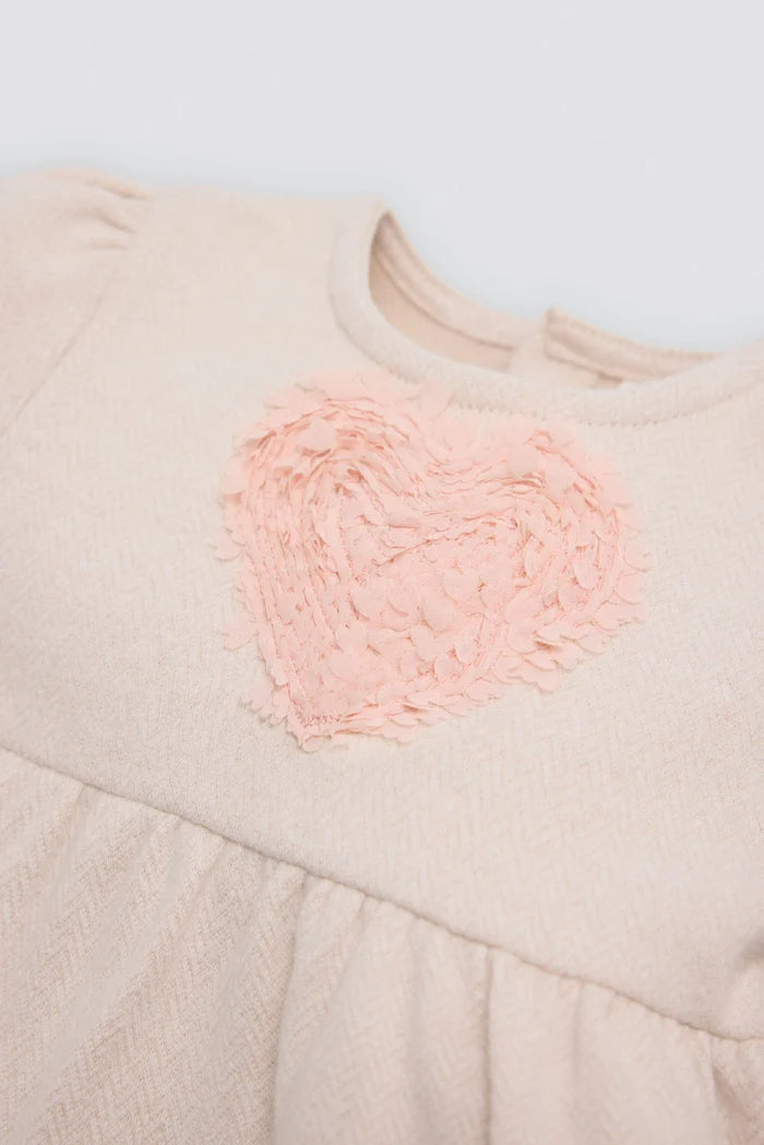Vestido bebé niña Ysabel Mora beige con corazón texturizado