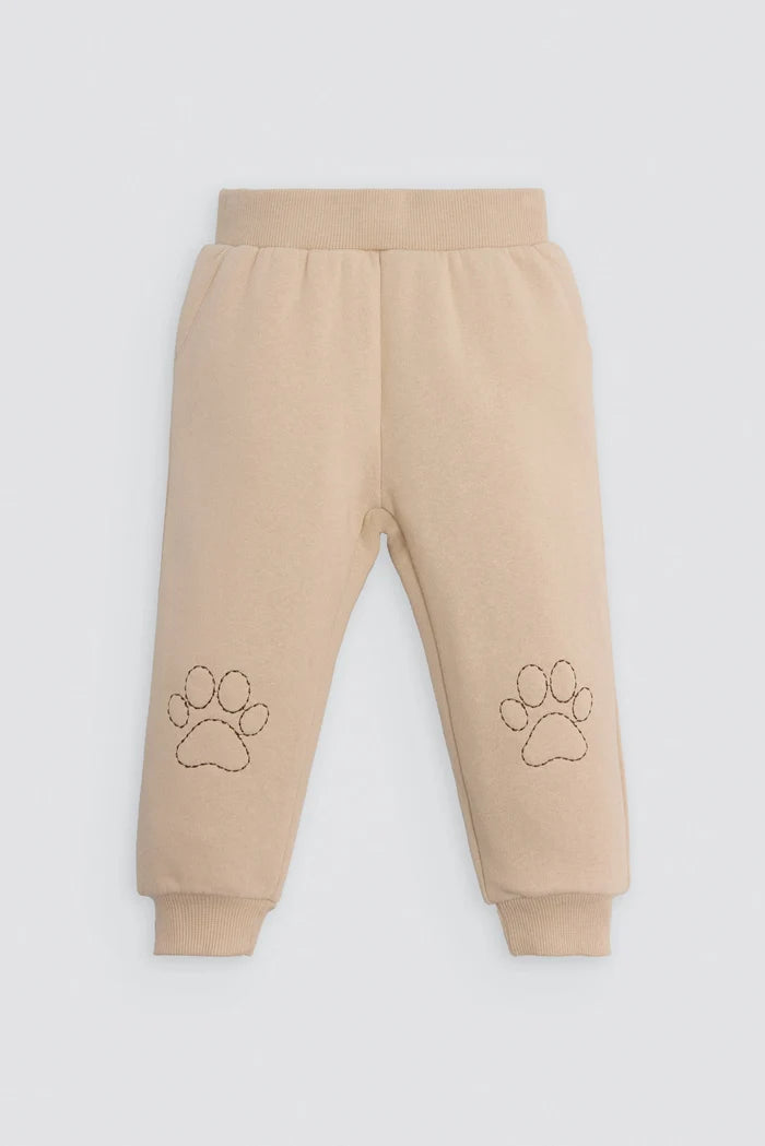 Conjunto de chándal bebé gato beige y azul con huellas en rodillas