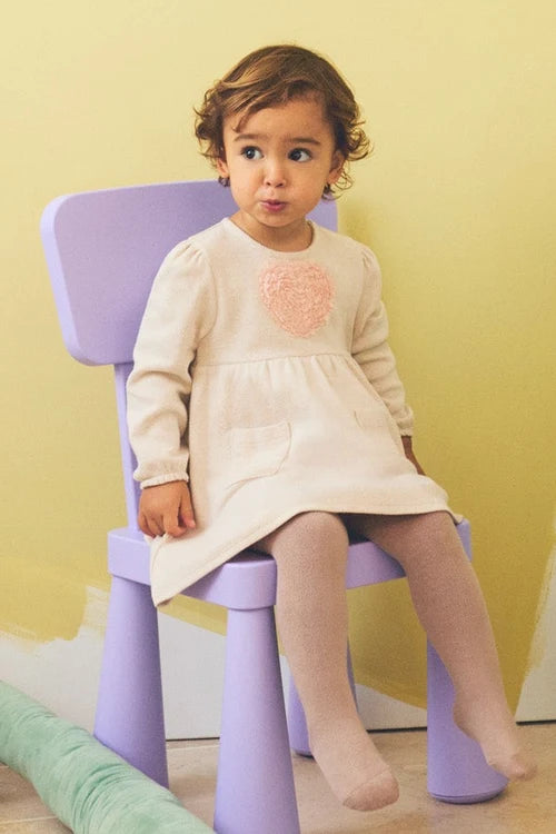 Vestido bebé niña Ysabel Mora beige con corazón texturizado