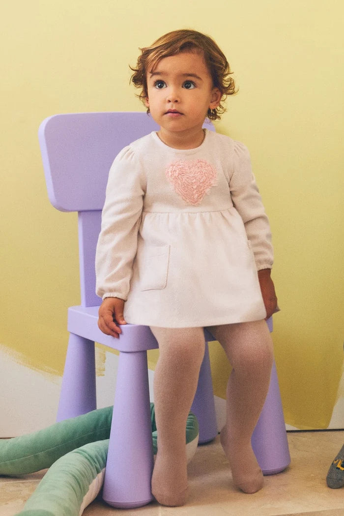 Vestido bebé niña Ysabel Mora beige con corazón texturizado
